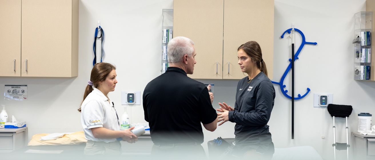 Sports Medicine working with student athlete