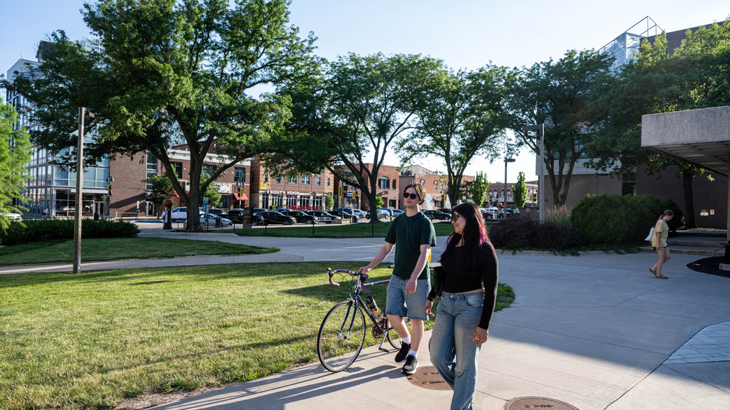 Two students walking together on campus.